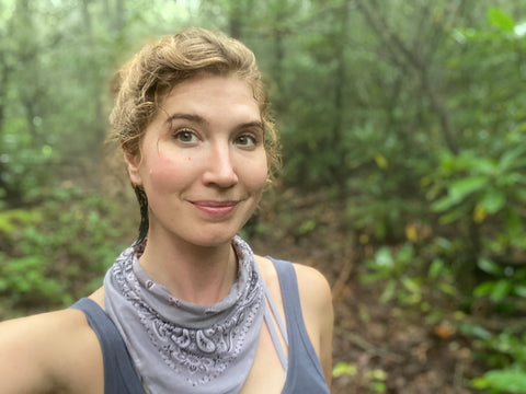 Aubrey hiking in her upcycled, rubber, adventure jewelry.