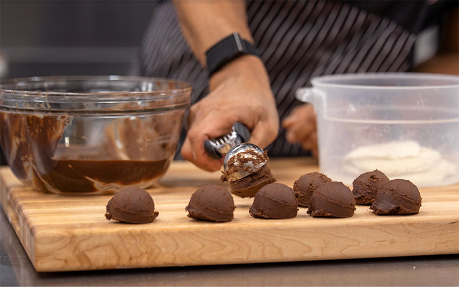 putting chocolate scoops onto board