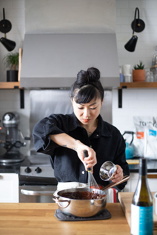 woman whisking chocolate in bowl