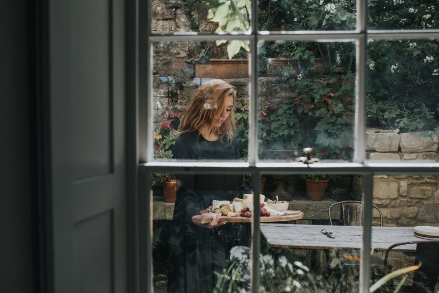 Girl outdoors with a plate of food