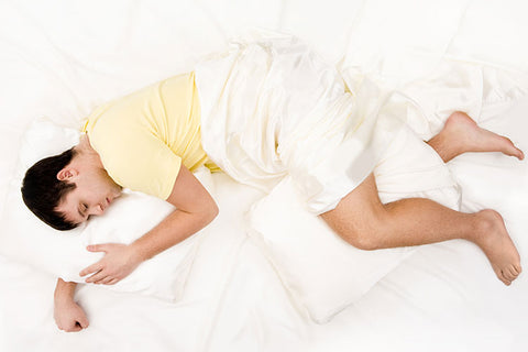 https://cdn.shopify.com/s/files/1/1896/7971/files/man-sleeping-with-pillow-between-his-knees_large.jpg?v=1587593191