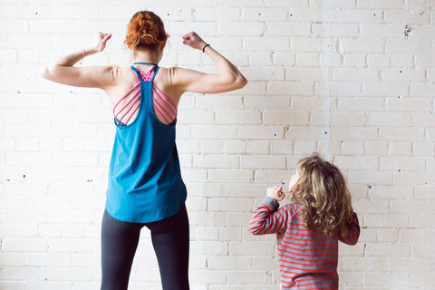 woman and child exercising 