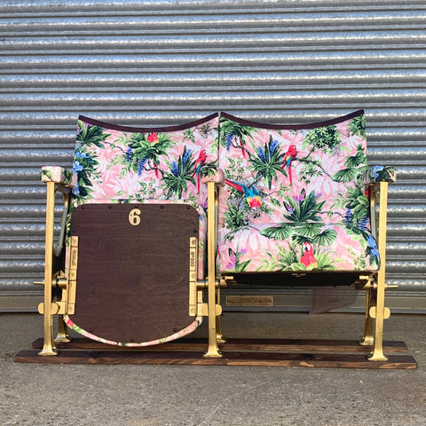 set of two cinema seats upholstered in pink parrot velvet