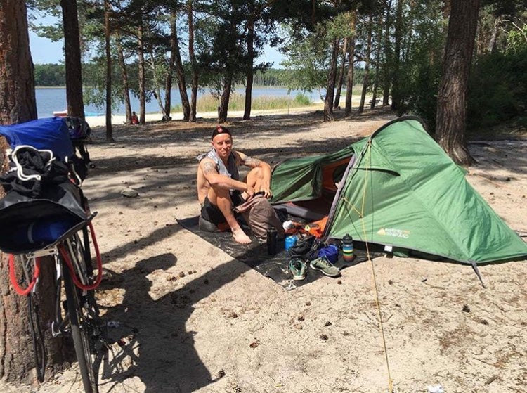 Ben Flanagan camping on a lake