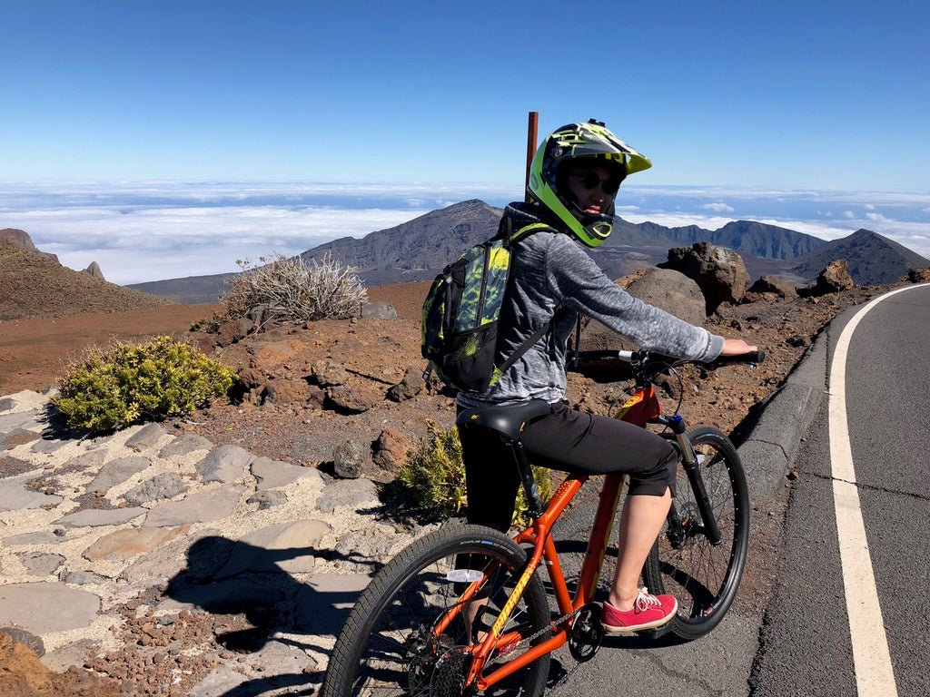 Descending Haleakala Volcano, Hawaii cherise on his bike