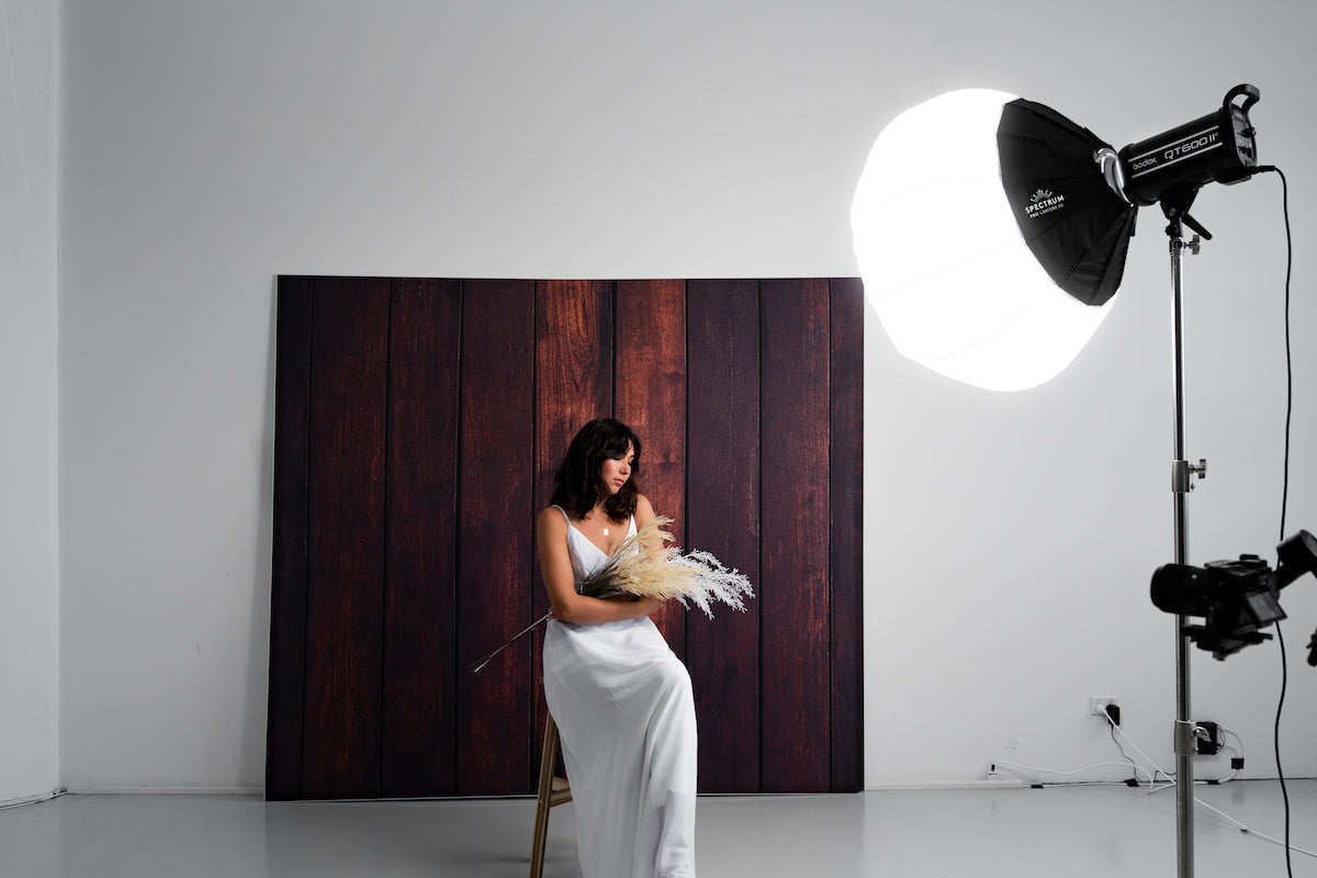 easiframe curved cyclorama backdrop in dark wood floor