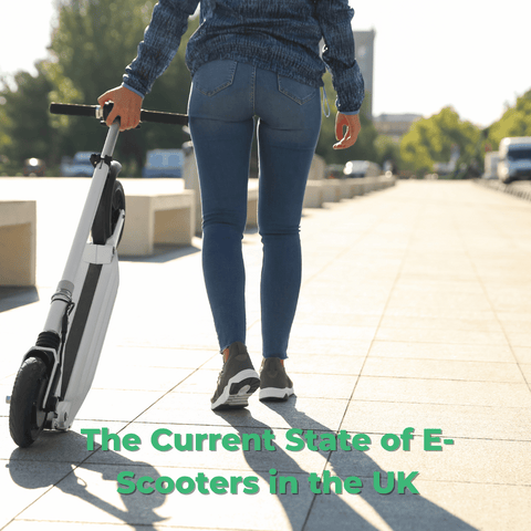 A young woman pulling her e-scooter
