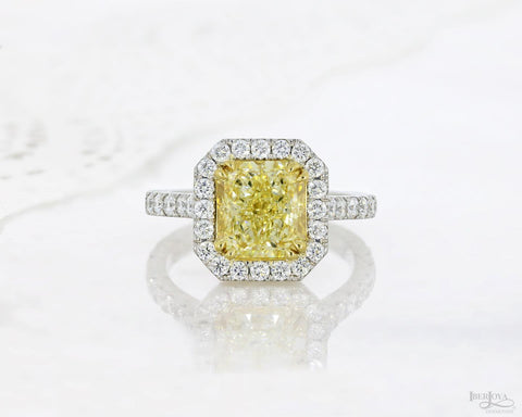 Yellow diamond halo engagement cocktail radiant diamond ring