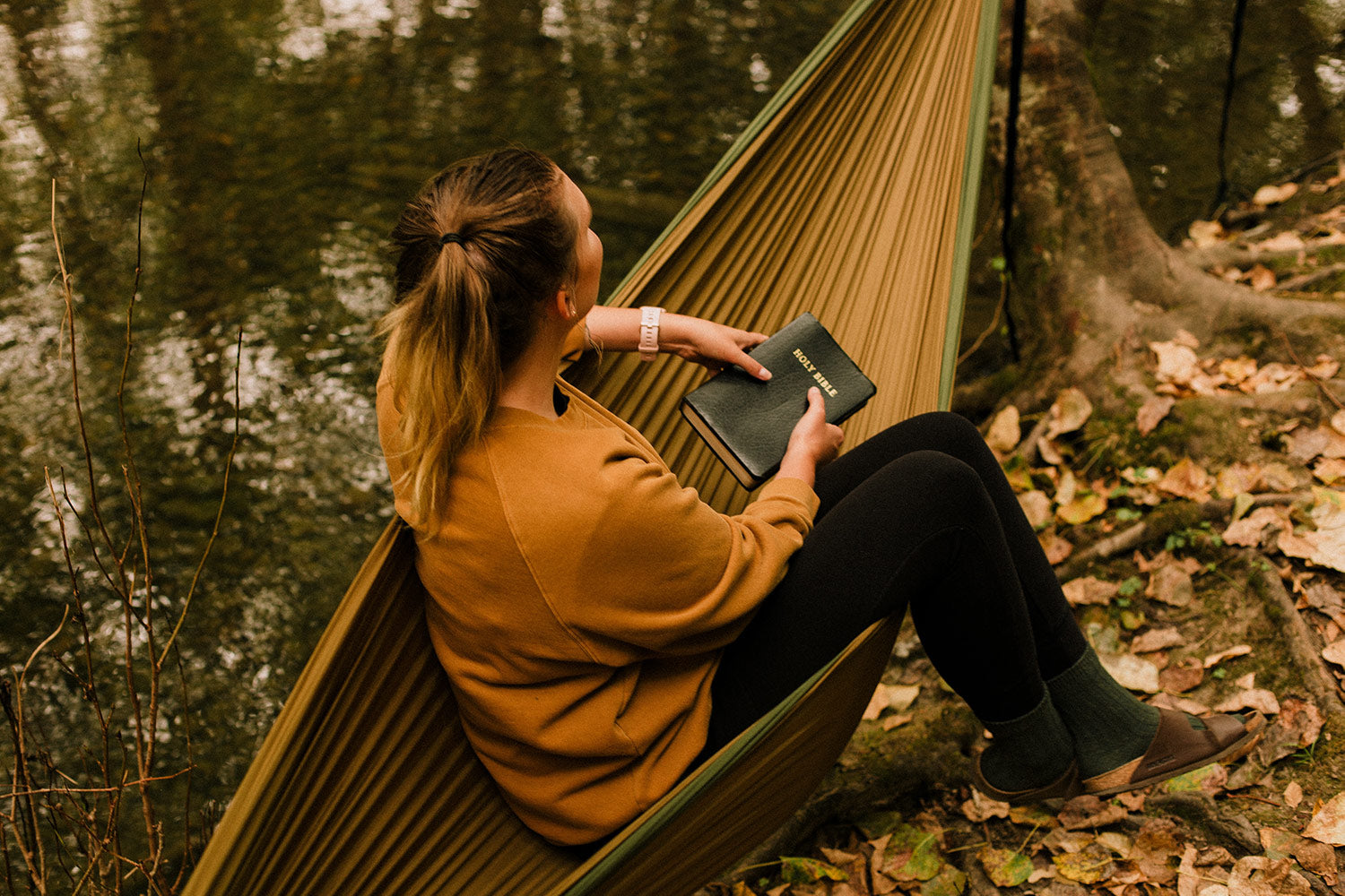 woman reading on hammock