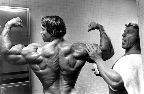 Arnold Schwarzenegger's shoulder workout high volume heavy weight lots of reps and sets