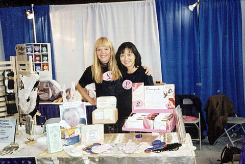 Madeleine Shaw and Suzanne Siemens sell period underwear at a trade show in 2001