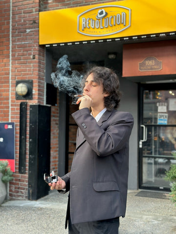 Dilan revolucion cigars, smoking Don Tomas cigar in Yaletown store
