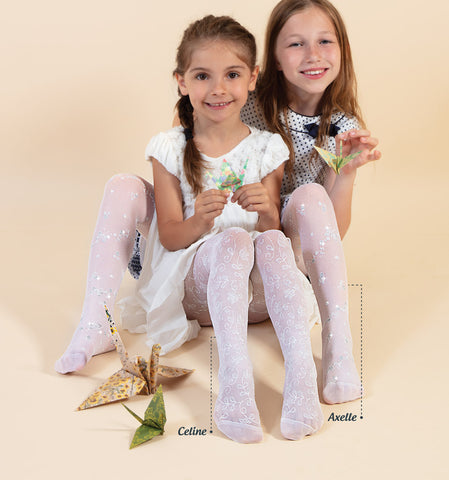 Two young girls sitting side by side wearing sheer white flower print tights.