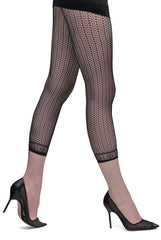 Side view of lady's legs striding in black fishnet footless tights and black heels.