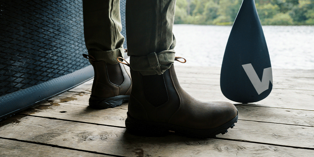 A man wearing the LANX, Ribchester Brown Distressed, outdoor walking chelsea boots