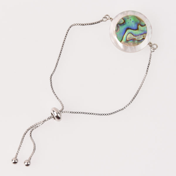 Silver bracelet with an abalone and white mother of pearl coin bead in the middle