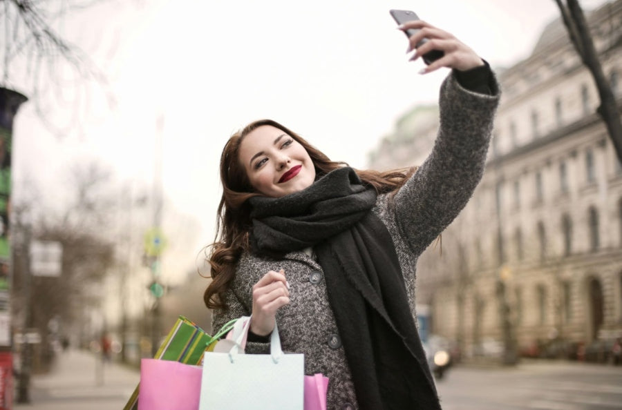 A millennial taking a selfie while shopping