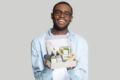 Men gift box with natural skincare in his hands