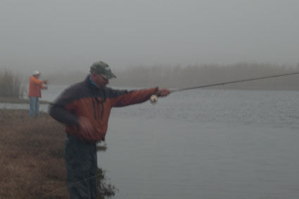 Casting a fly rod on a  foggy morning on the St. Johns.