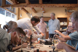 Capt. Justin Price instructing fly tying.