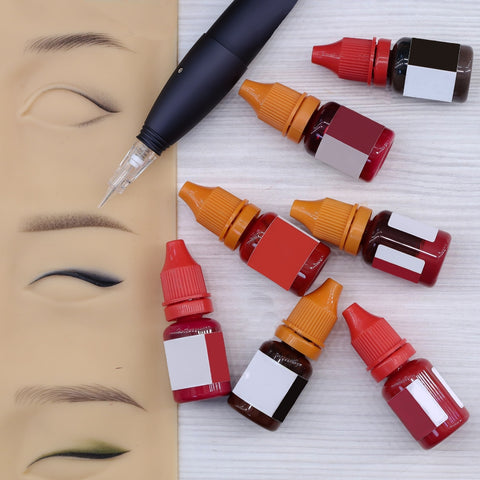 PMU pigments, PMU machine, and PMU practice skin with brow strokes and permanent eyeliner