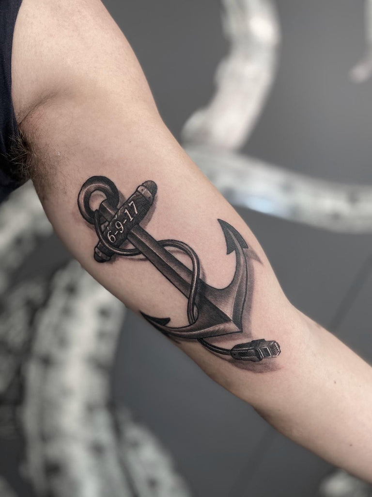 Black and grey anchor tattoo done on Squid Ink