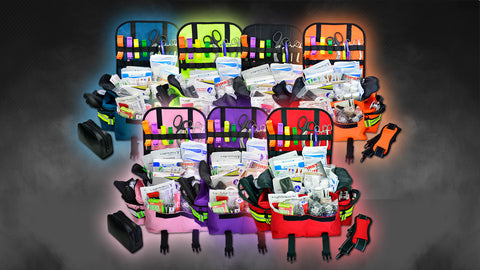 Multiple emergency medical kits in various colors, displaying organized compartments filled with essential medical supplies like bandages and scissors, suited for immediate response in various medical emergencies.