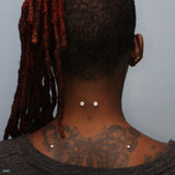 Nape piercing by Kellan