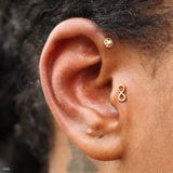 Tragus piercing by Andru
