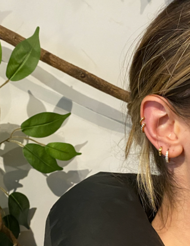 girl with 4 piercings wearing hypoallergenic hoop earrings 