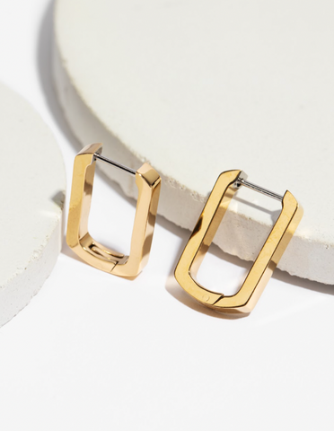 trendy and gold oval shaped hypoallergenic huggie hoop earrings 