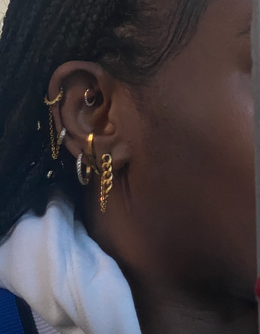 britanny tini lux wearing an all gold hypoallergenic earring stack