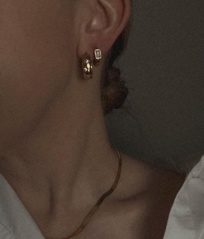 girl wearing tini lux hypoallergenic earring stack