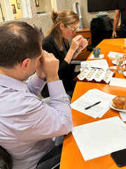 Kelly Glennon uses a loupe to inspect jewelry