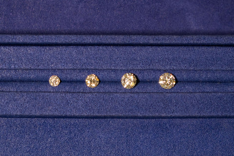 Image of diamonds lined up next to each other to show sizes