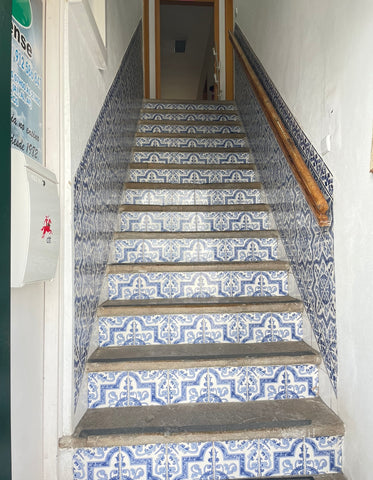 blue and white tiles in home stairs