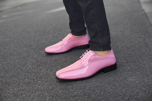 a pair of mens pink dress shoes