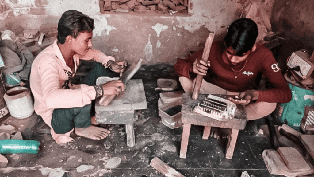 artisans carving wood in bagru for block printing