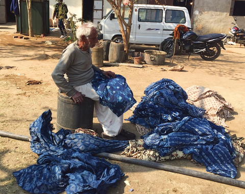 indigo fabric being sorted and inspected