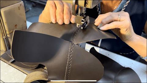 sewing the pieces of the shoe together
