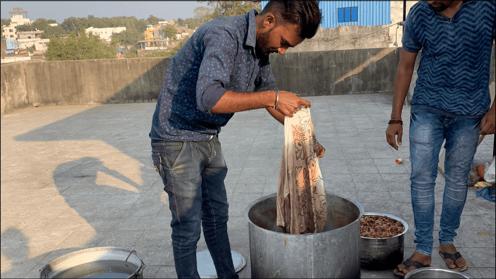 shirt being dyed with onion skins