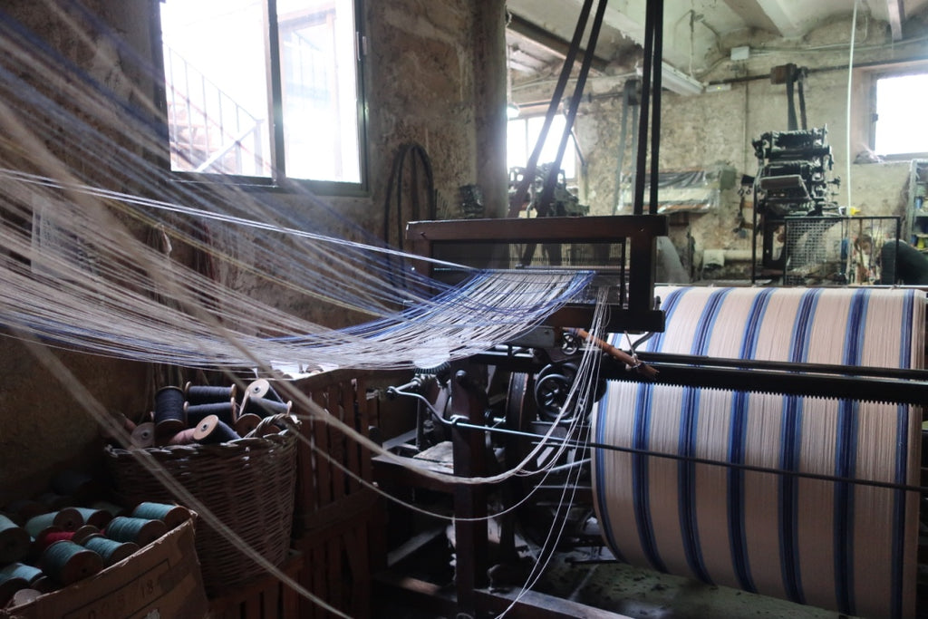 dyed yarns being wound onto a warp beam