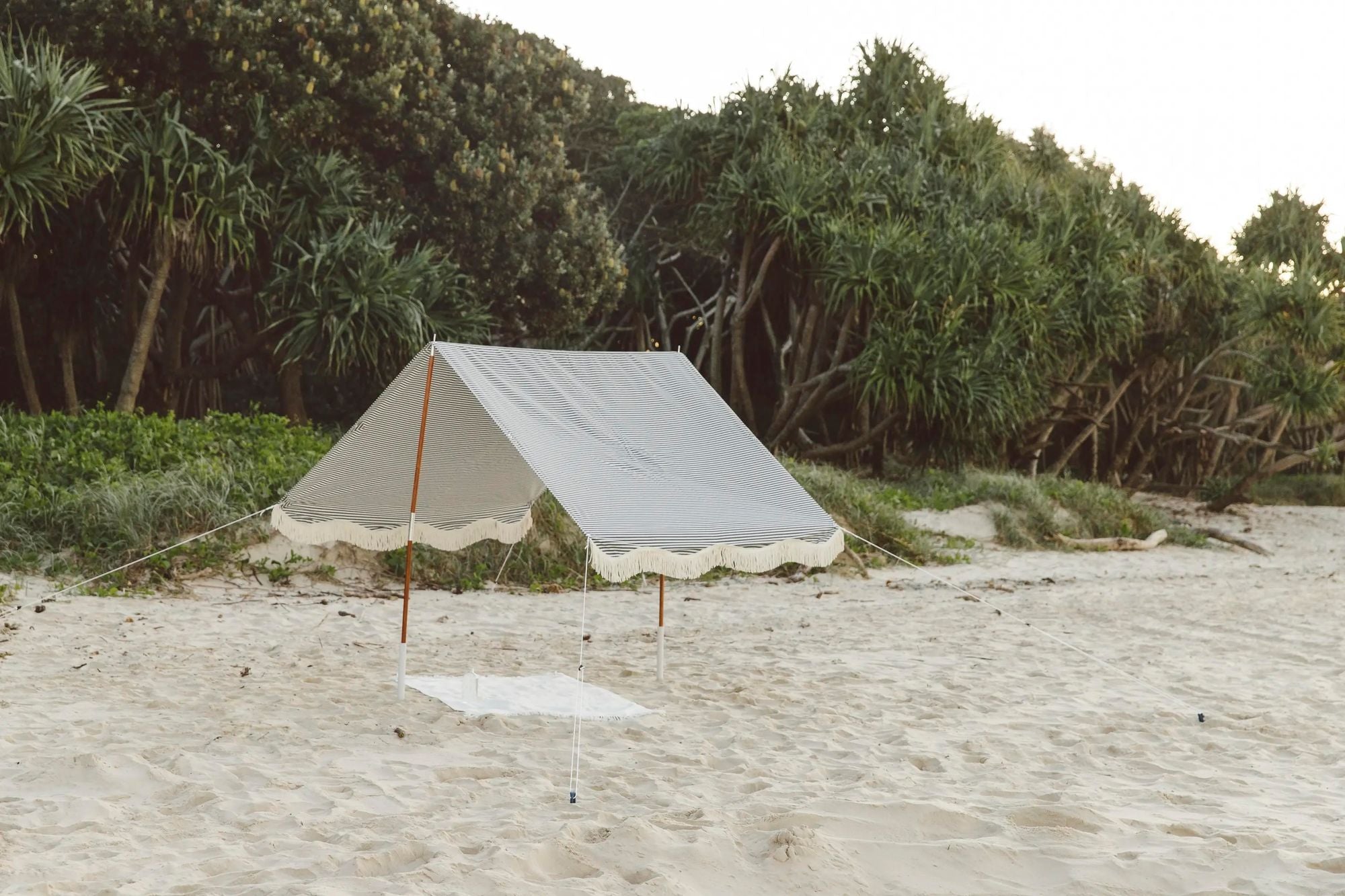 Lauren's Navy Striped Beach Tent on the sand