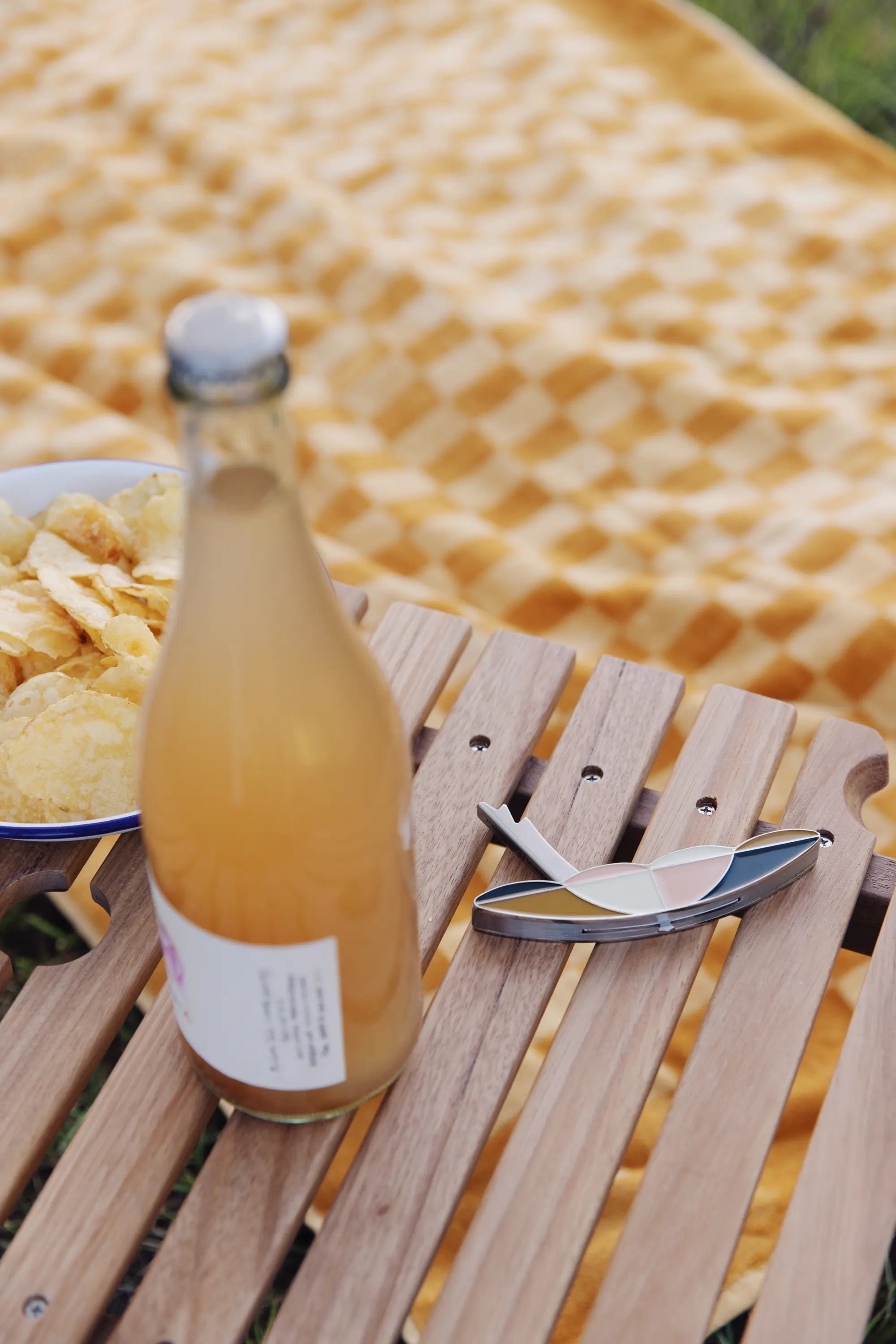 Picnic Table with a drink and bottle opener