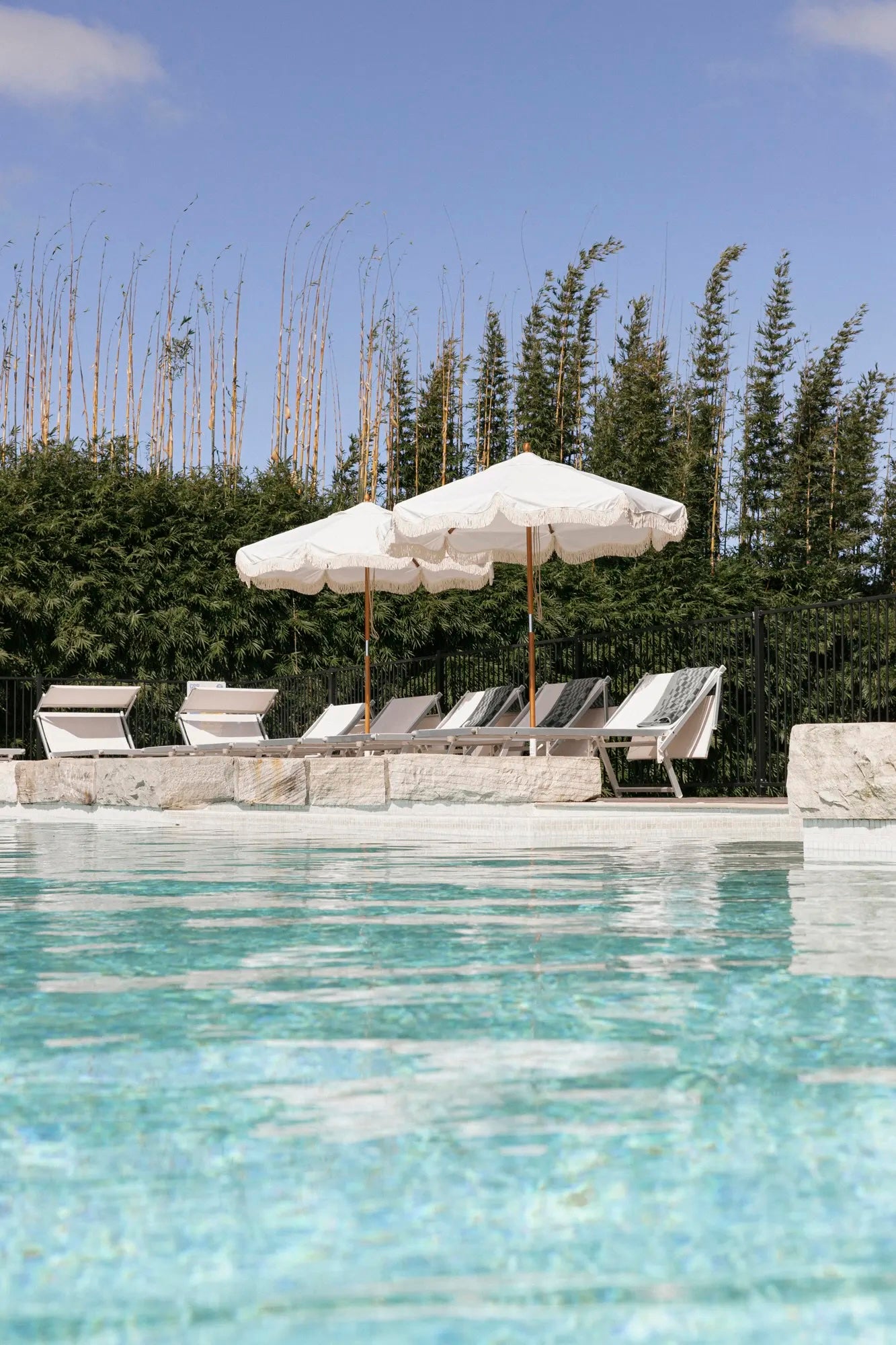 White Market Umbrellas by a pool