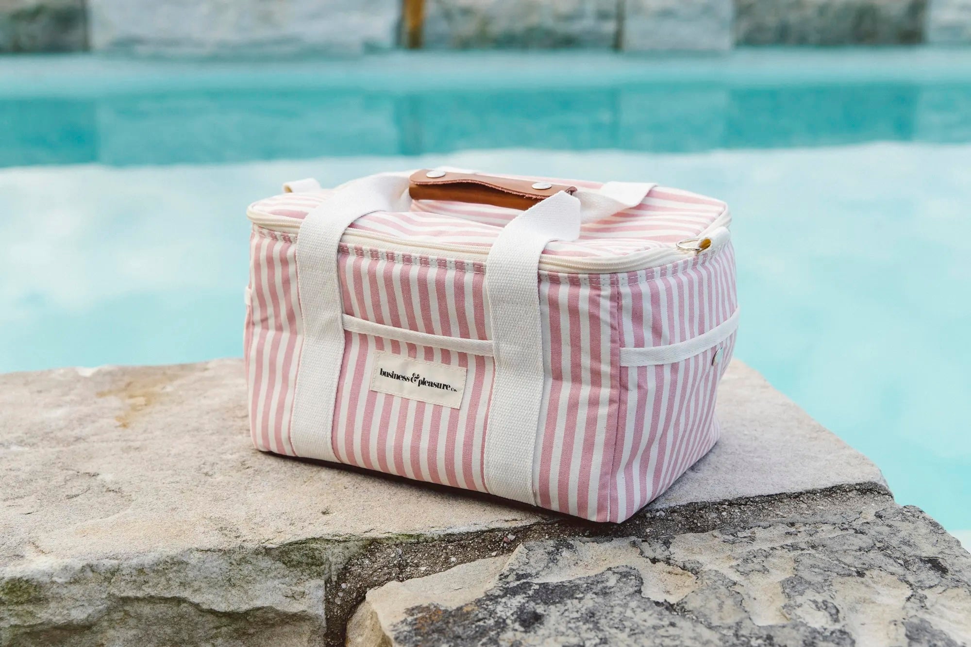 Lauren's Pink Stripe Cooler Bag by the pool