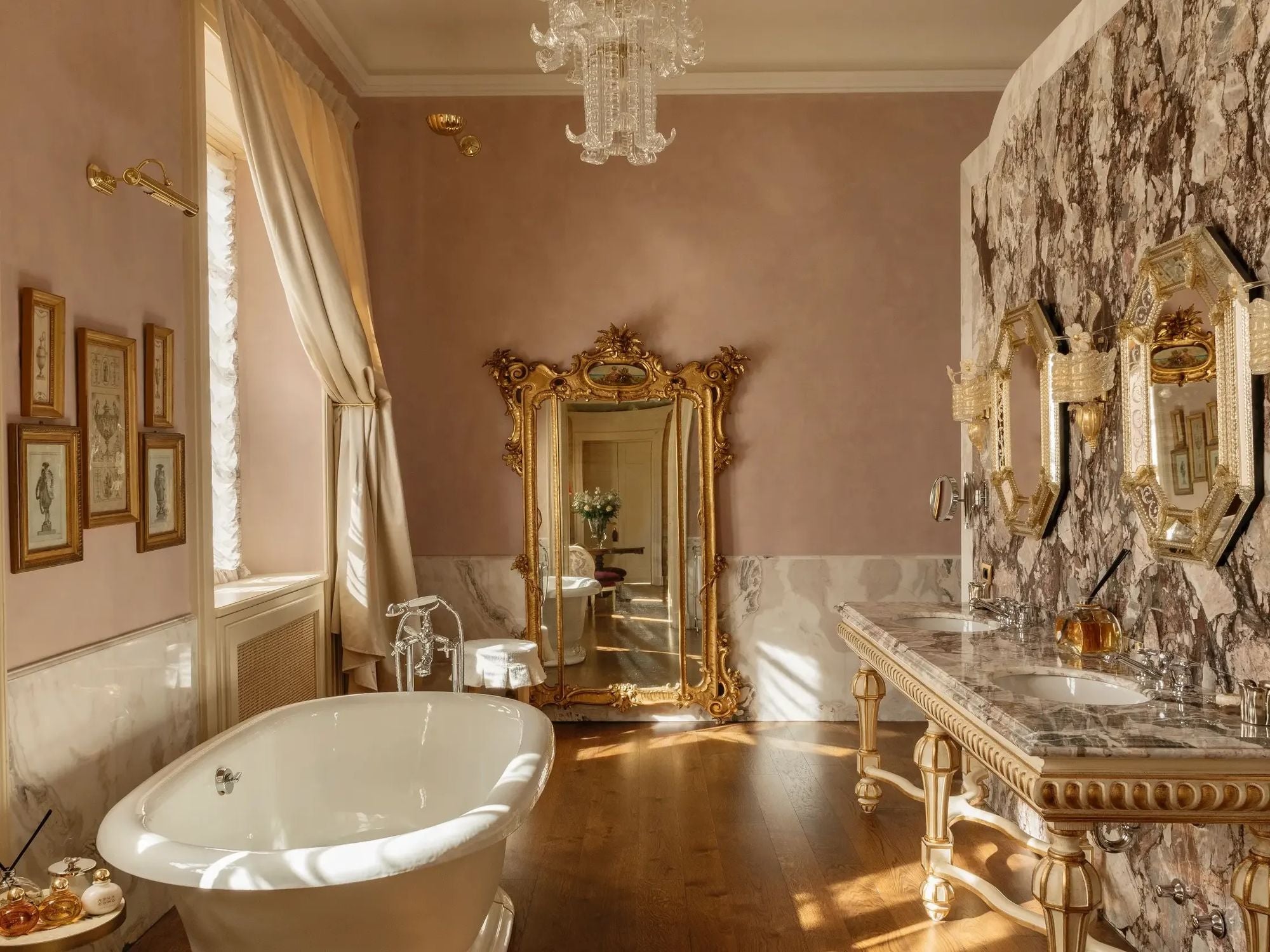 bathroom with marble sinks and bathtub