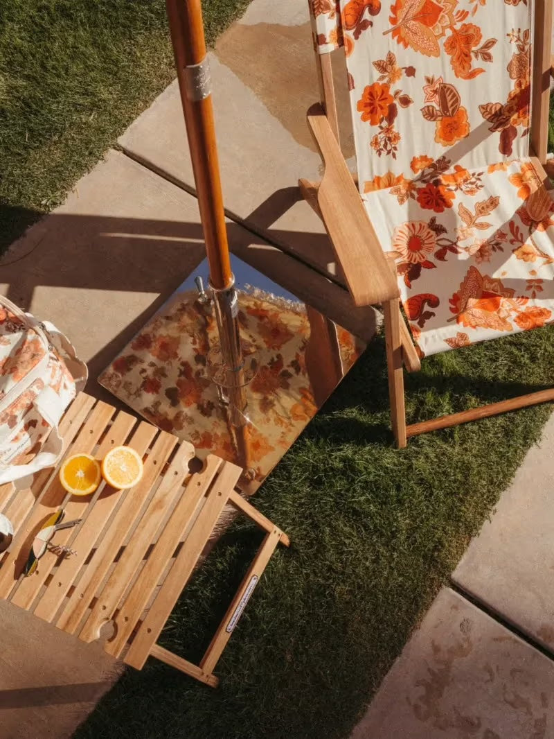 Picnic table and chair with an umbrella and umbrella base