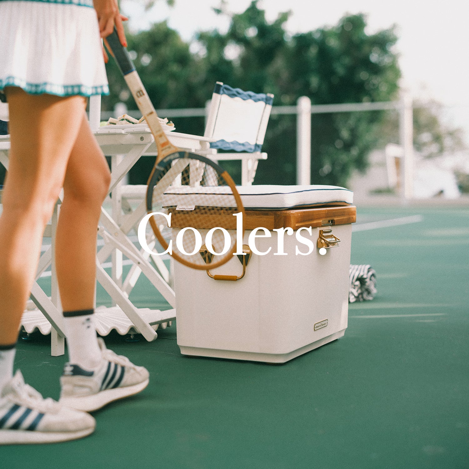 White cooler on a tennis court