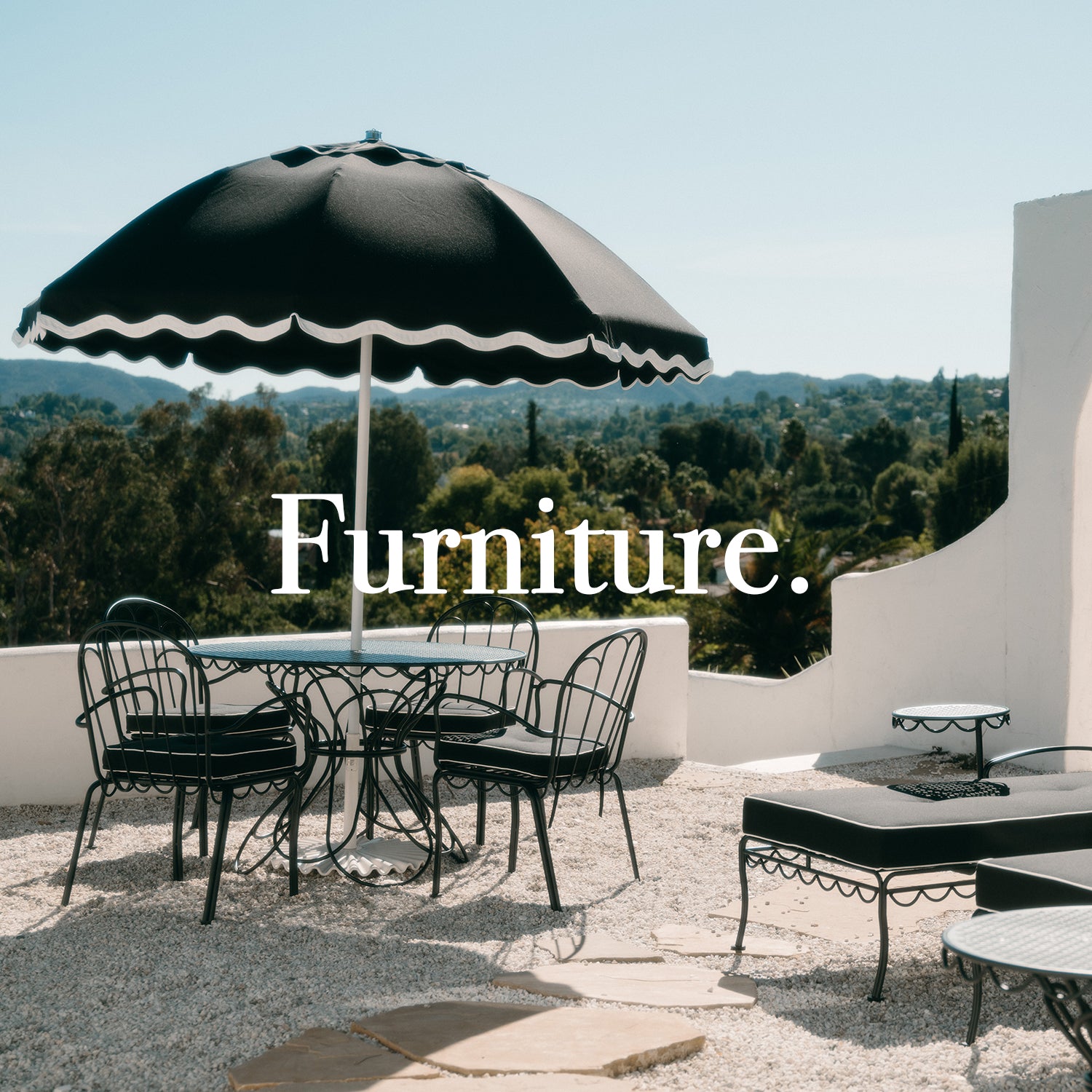 Black umbrella and patio furniture 